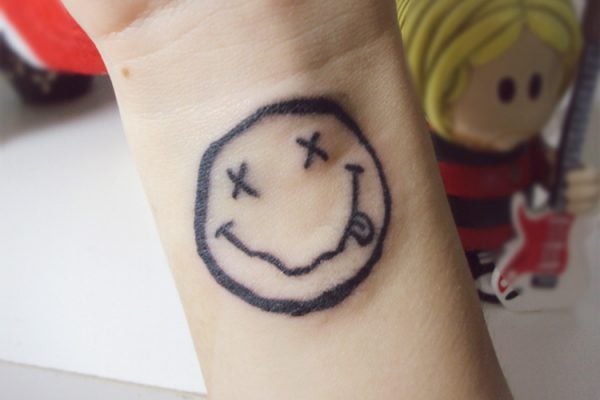 Show Off Your Fun Side With These Smiley Tattoos