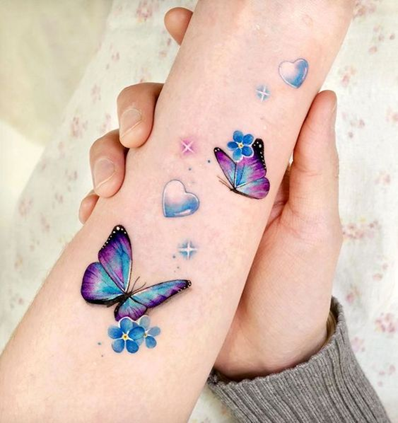 small butterfly tattoos on hand