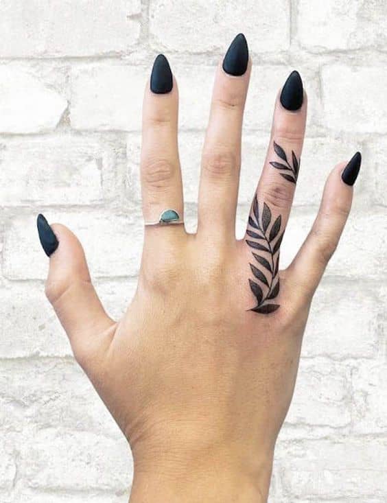 Lavender tattoo on the left ring finger